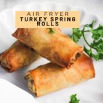 Air fryer turkey spring rolls with text on the image.