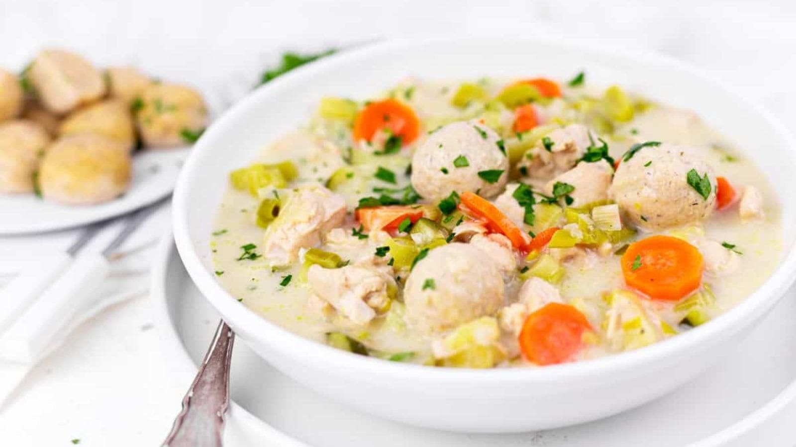 A bowl of homemade chicken soup with dumplings.