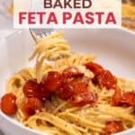 A bowl of baked feta pasta with spaghetti and cherry tomatoes; a fork holds a twirl of pasta above the bowl.