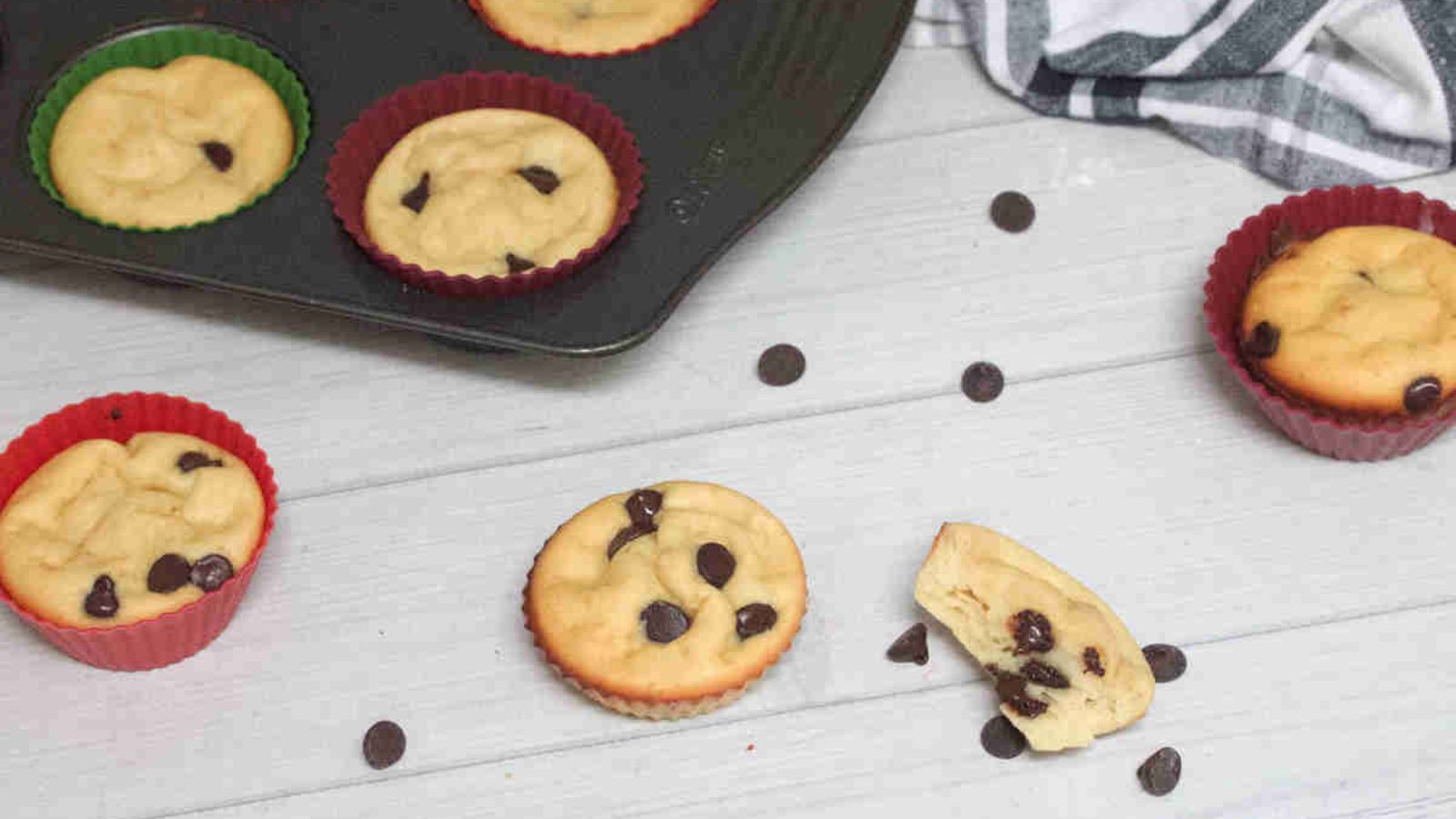Yogurt and chocolate chip muffins with chocolate chips around them.