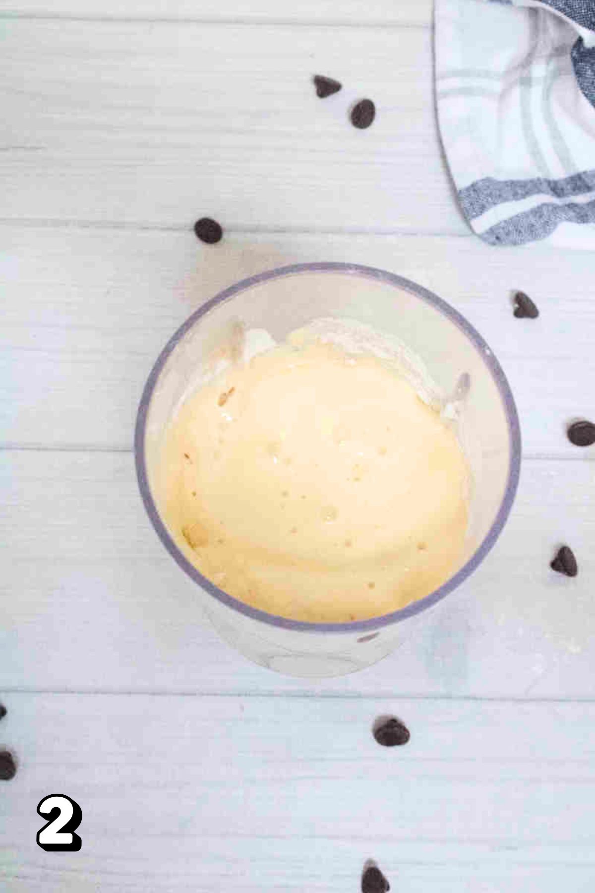 A blender with raw, yogurt-based muffin batter.