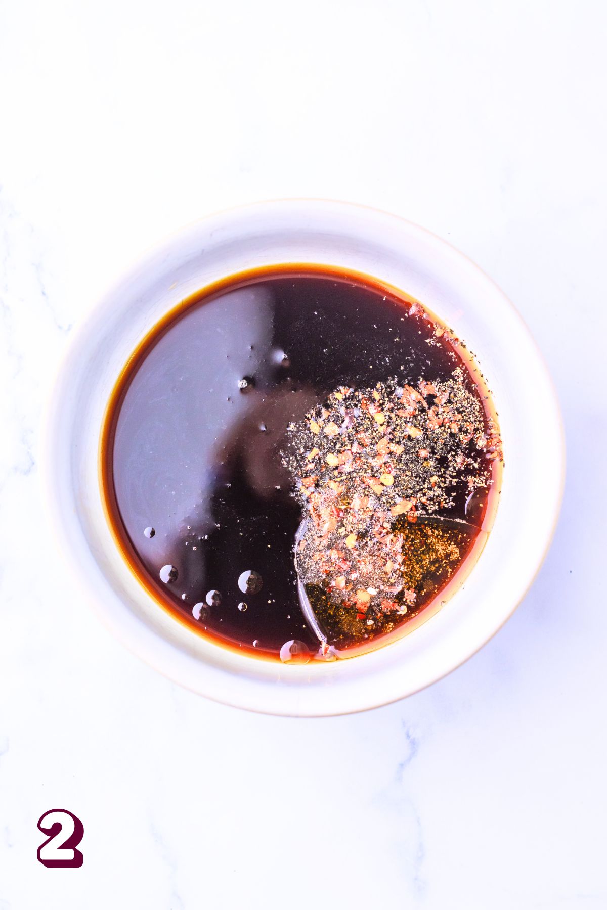Mongolian sauce in a white bowl.