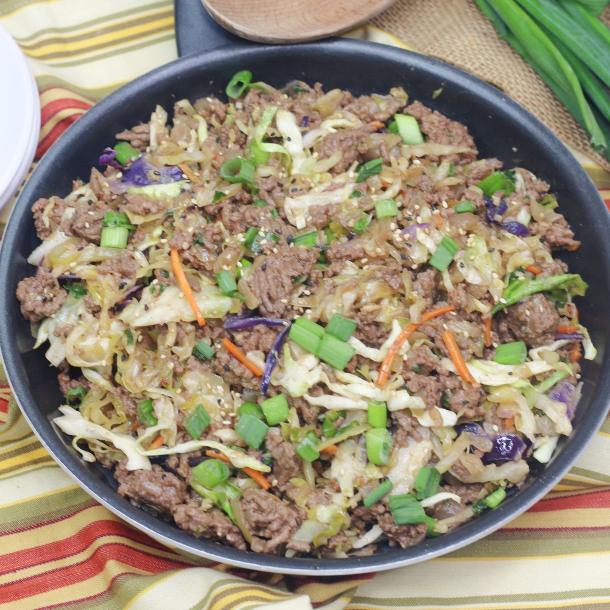 Inside out egg roll with ground beef in a skillet.