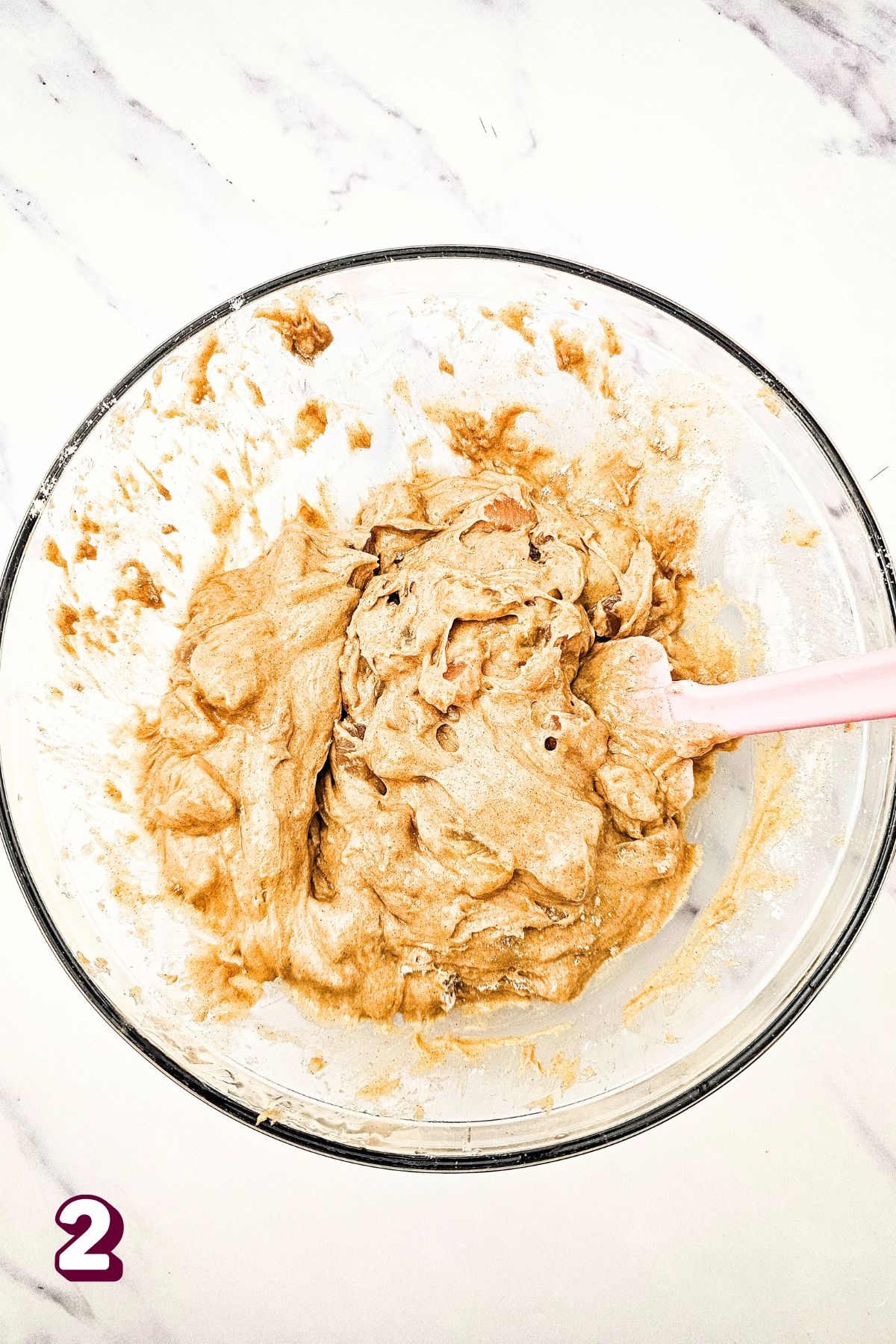 Bowl of raw apple pie muffin batter.