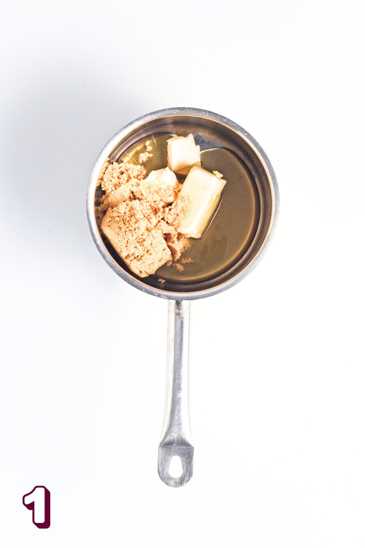 Small pot with butter, honey, and brown sugar in it.