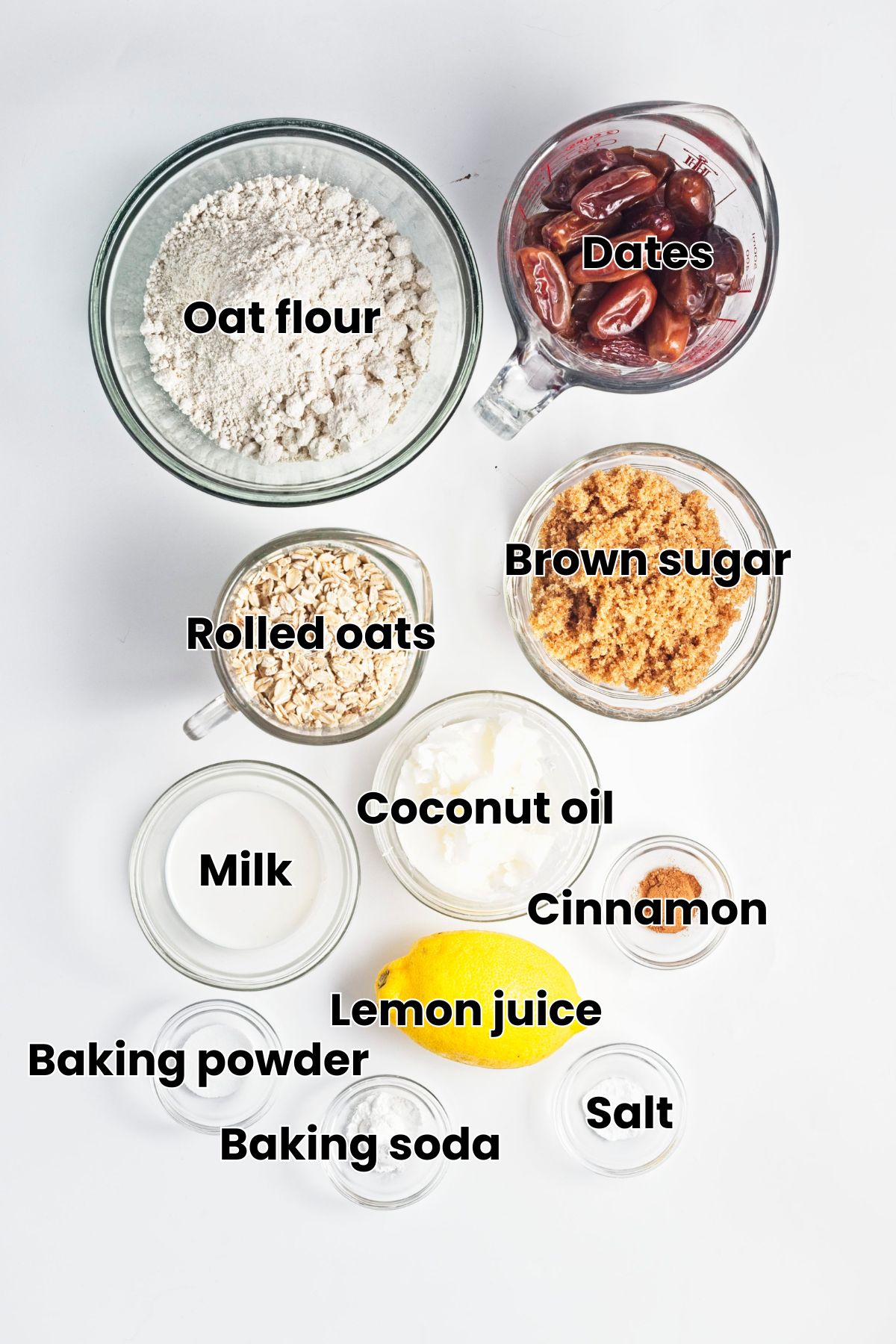 Multiple ingredients like oat flour, dates, brown sugar and more in glass bowls with text over the top.