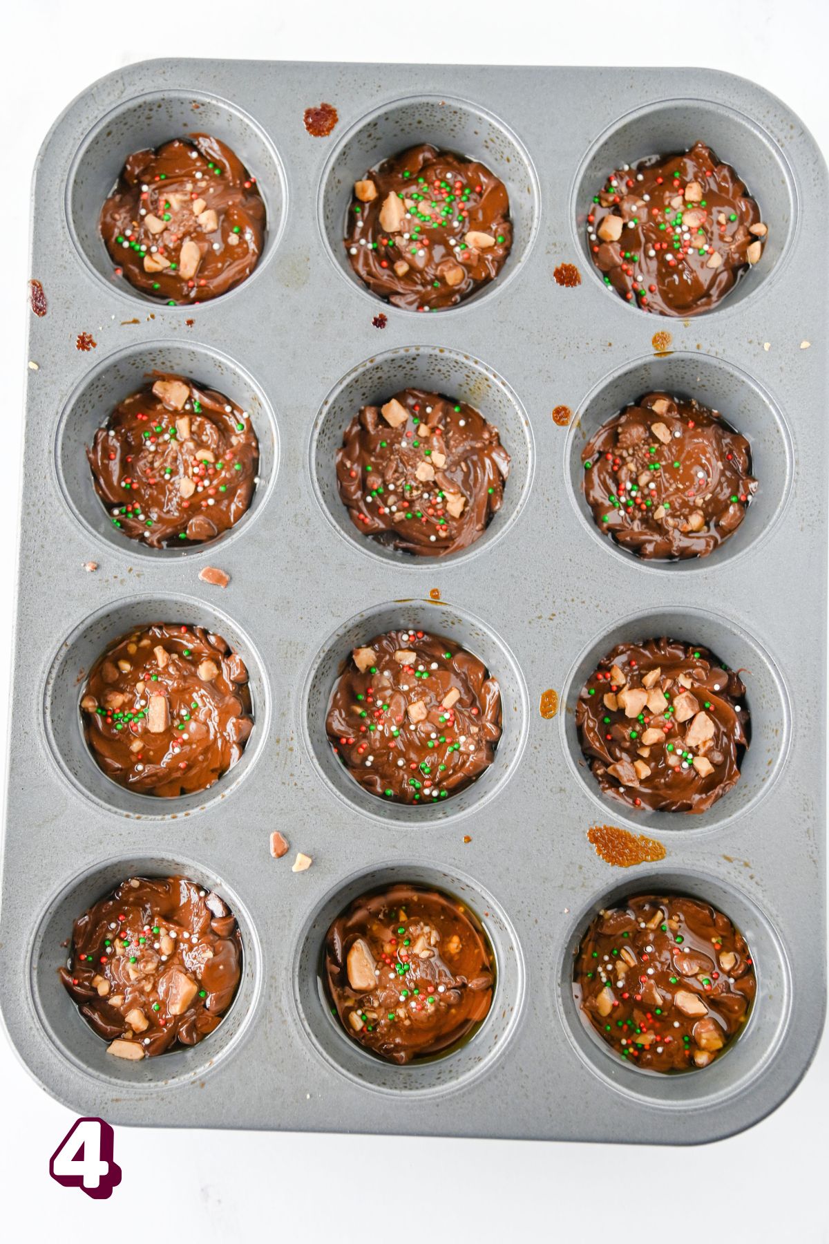 Muffin topped with Christmas crack cookies.